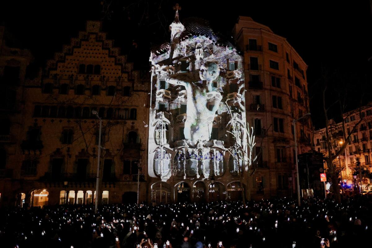 Casa Batllo, designed by Catalan architect Antoni Gaudi, is illuminated with a video-mapping artwork by British artist Matt Clark and American-born Japanese contemporary dancer Fukiko Takase to mark the centenary of Gaudi's death, in Barcelona, Spain.