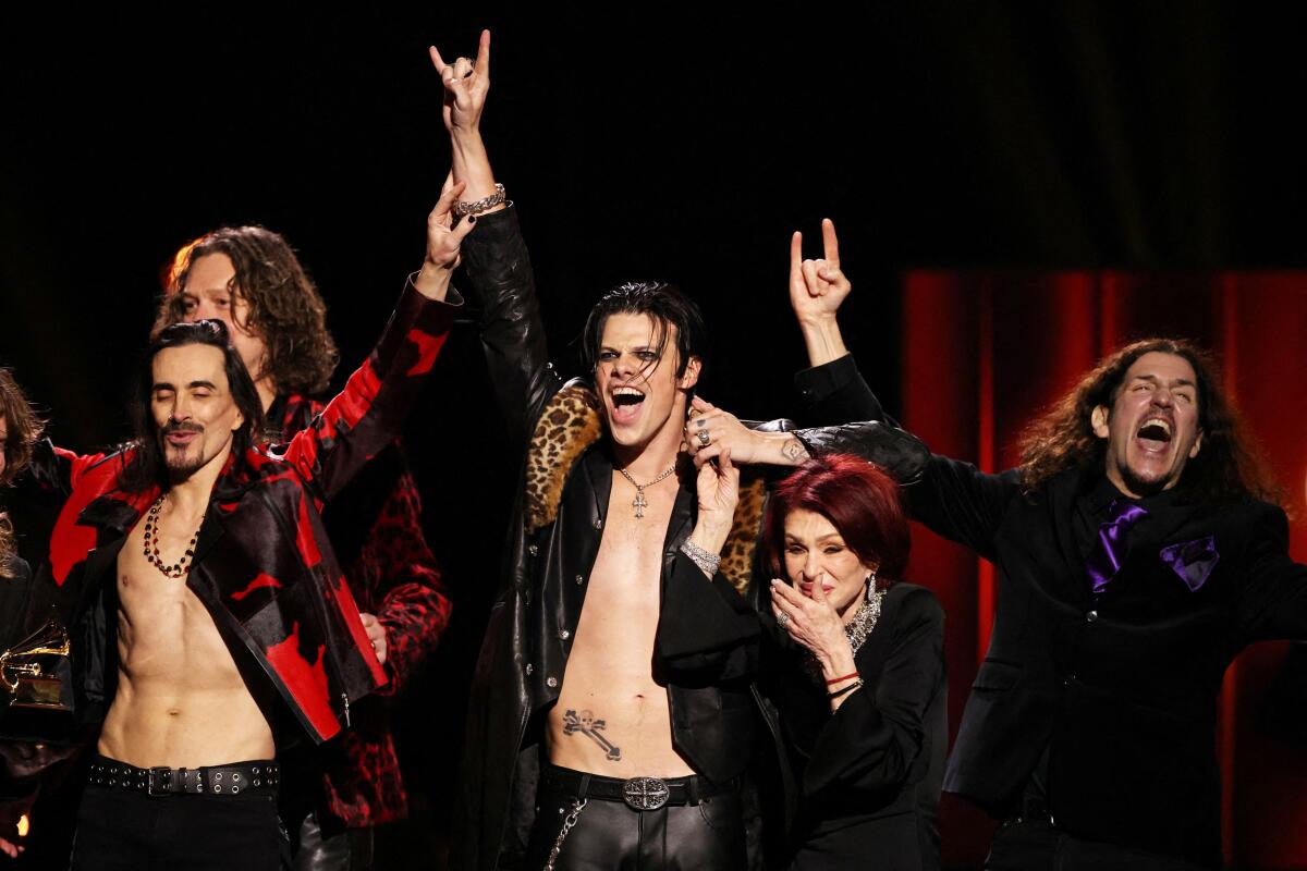 YUNGBLUD accepts the Best Rock Performance award for "Changes (Live From Villa Park) Back To The Beginning" next to Sharon Osbourne during the premiere ceremony of the 68th Annual Grammy Awards in Los Angeles, California, US.