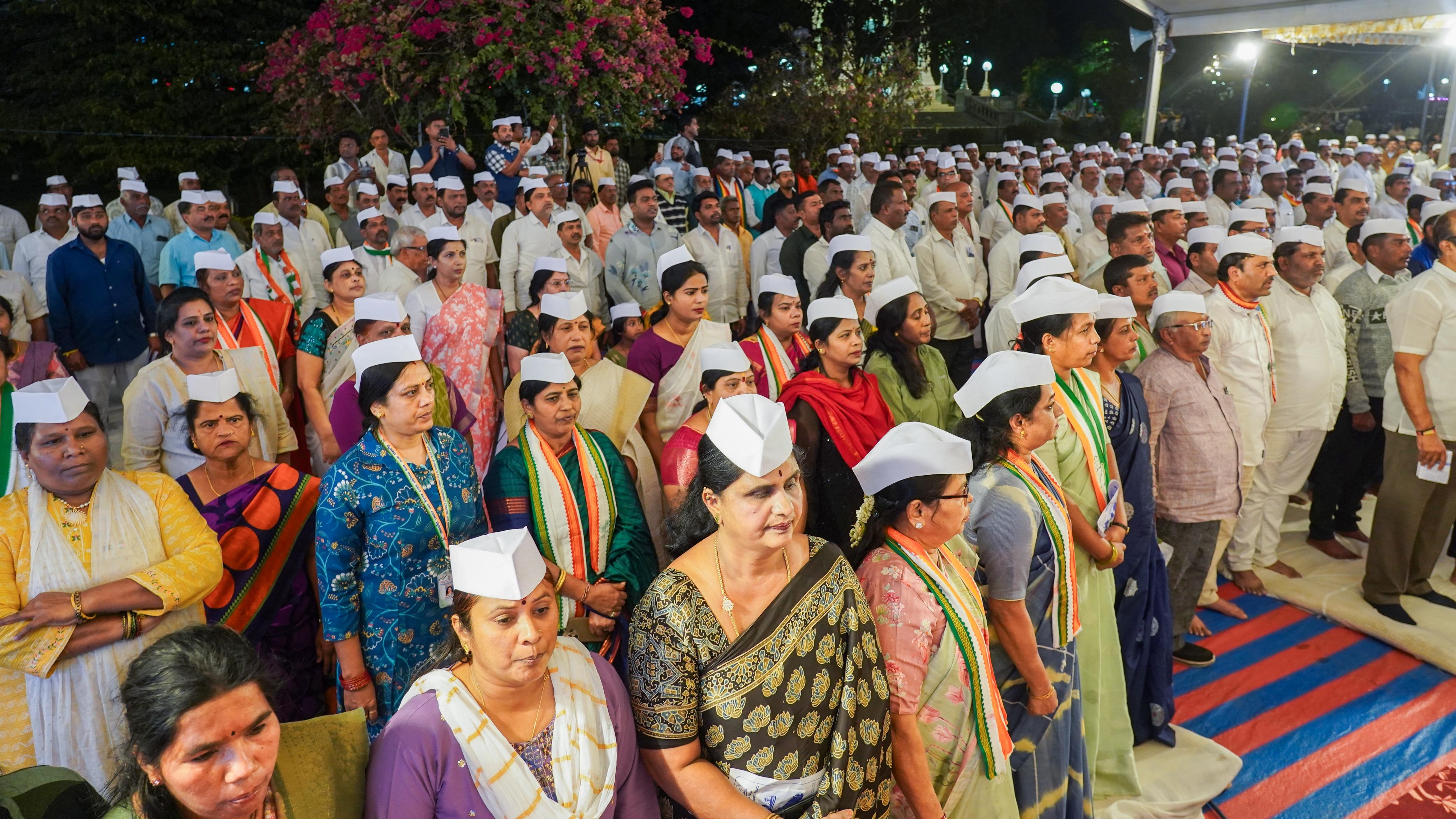 Congress members during the overnight protest against VB-G-RAM-G Act, in front of Sir C V Rangacharlu Town Hall, in Mysuru, on Sunday. DH Photo