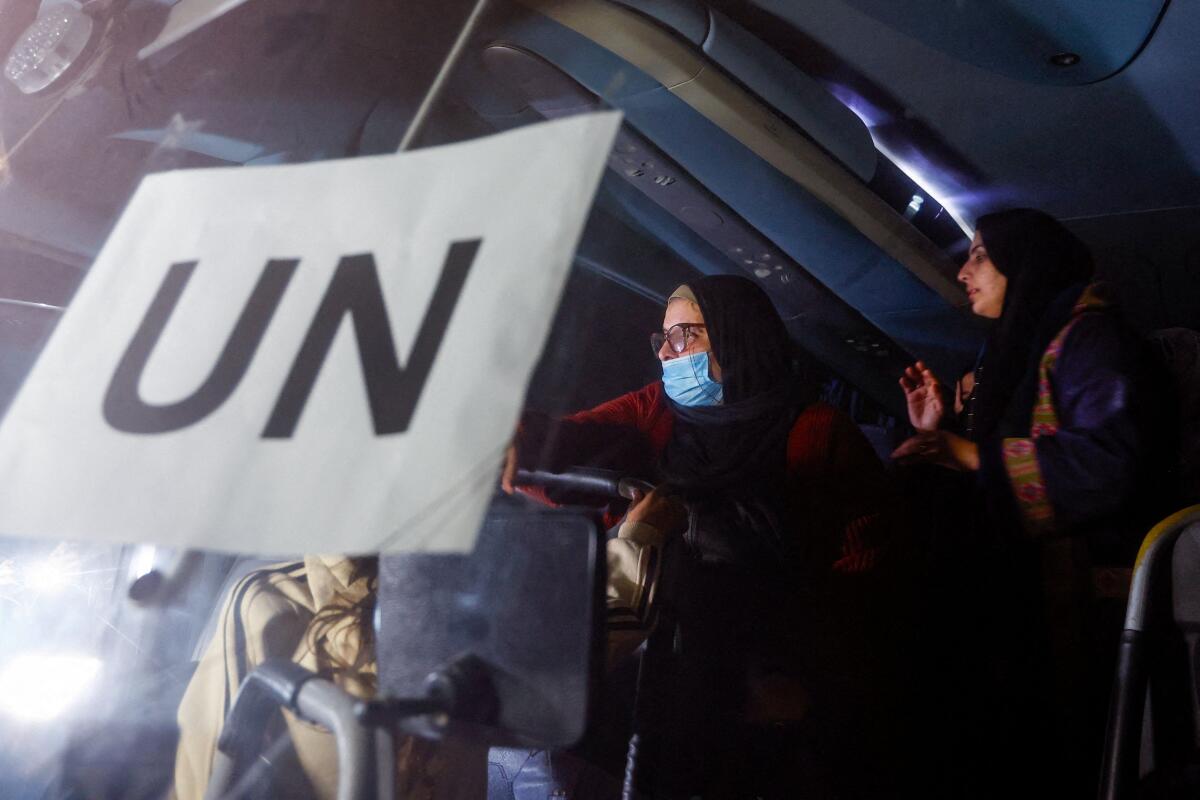 Palestinians coming from the Rafah border crossing between Gaza and Egypt after it was opened by Israel on Monday for a limited number of people, arrive, in a vehicle with a United Nations (UN) label, at Nasser Hospital in Khan Younis in the southern Gaza Strip.