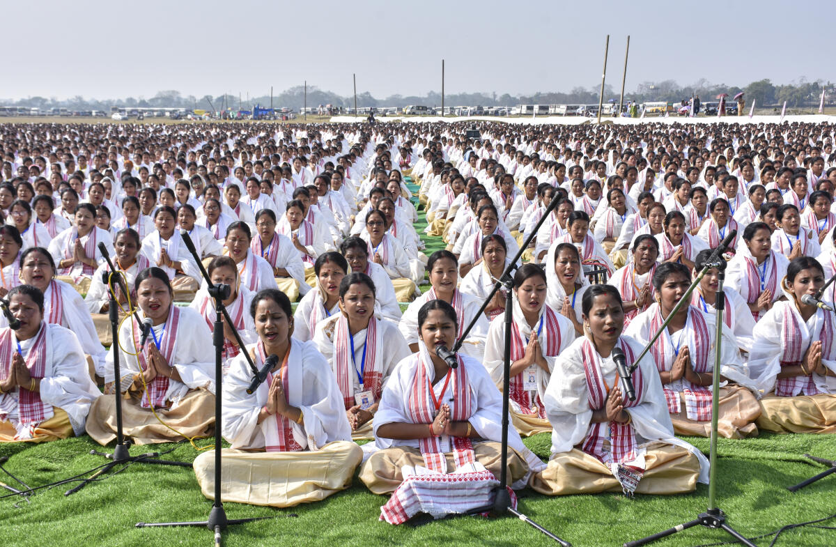 A congregation of 15,555 women sing the traditional Assamese wedding song 'diha naam' at Jeranga playground in their attempt to set a world record, in Sivasagar, Assam.