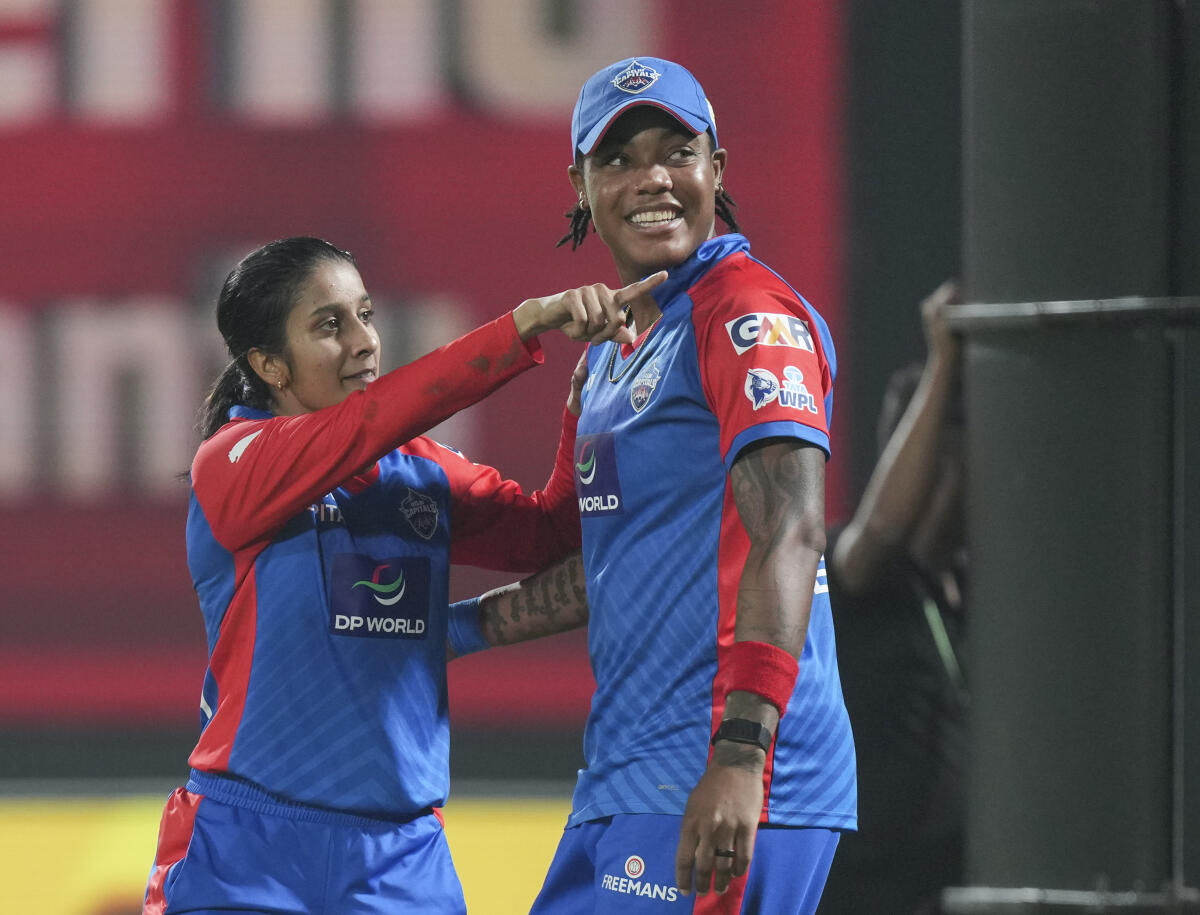 Delhi Capitals' captain Jemimah Rodrigues, left, with teammate Chinelle Henry after their win over Gujarat Giants in the Women's Premier League (WPL) 2026 eliminator T20 cricket match, in Vadodara, Gujarat.