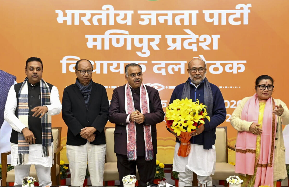 Former minister and Assembly Speaker Yumnam Khemchand Singh with National General Secretary Tarun Chugh and former Manipur CM N Biren Singh after being elected as BJP Legislature Party leader, in New Delhi.