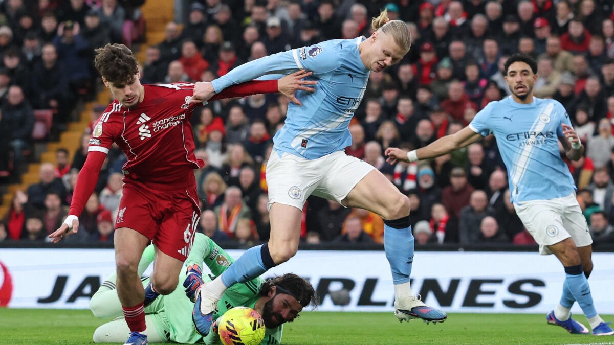 Man City snatch chaotic 2-1 win at Liverpool to stay on Arsenal's heels