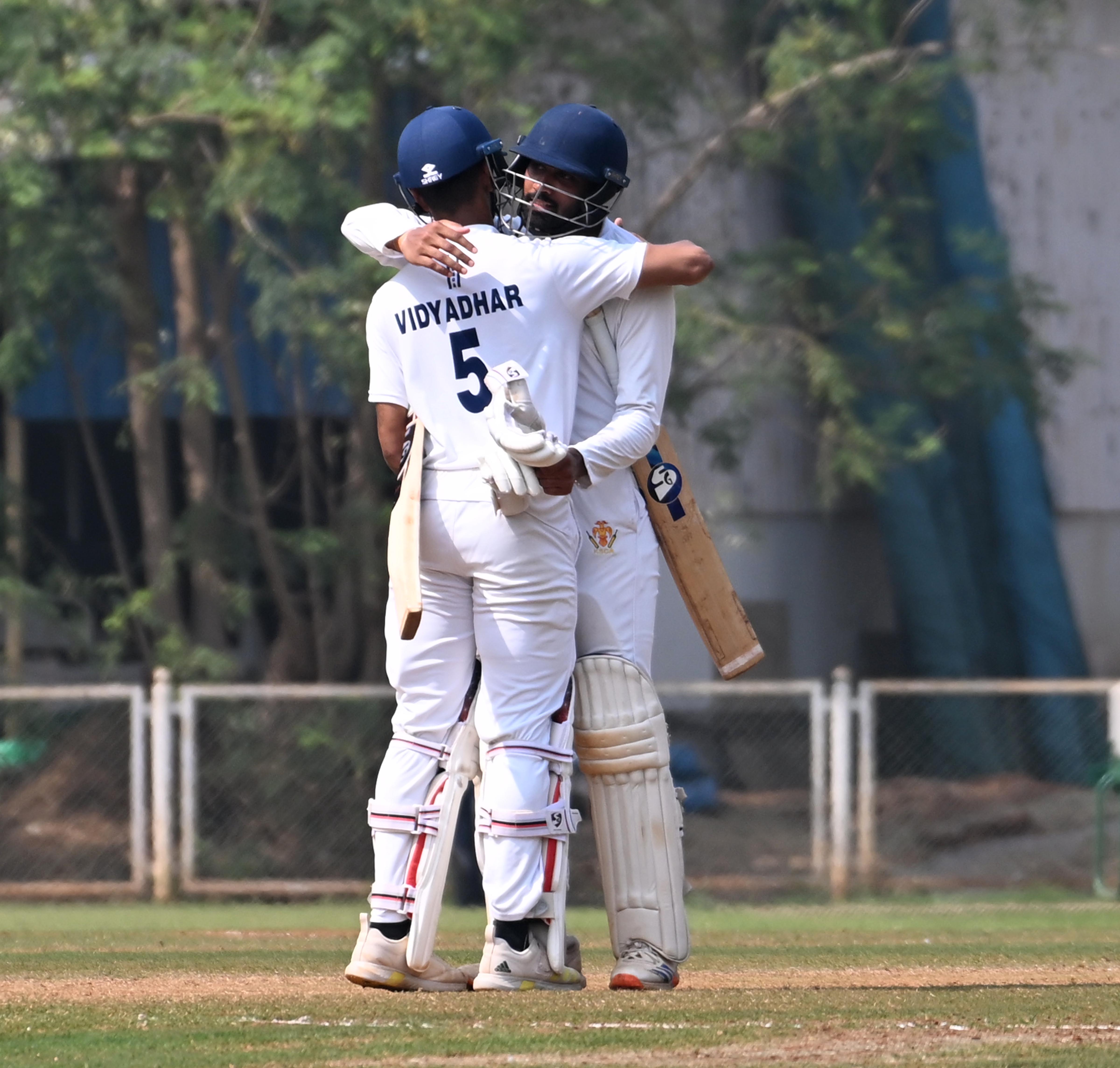 R Smaran (right) embraces Vidyadhar Patil who scored the winning runs.    