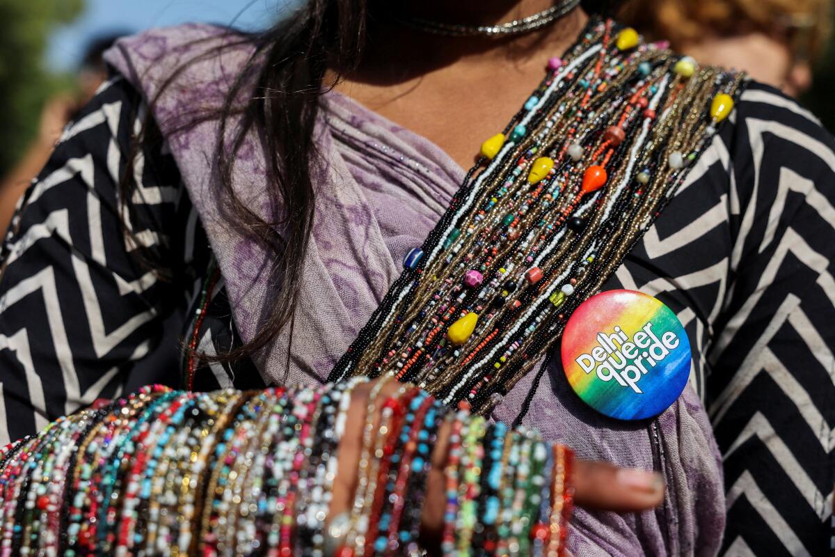 A person wears a badge while taking part along with others in Delhi Queer Pride March, an event promoting LGBTQ+ rights, in New Delhi, India, February 8, 2026.