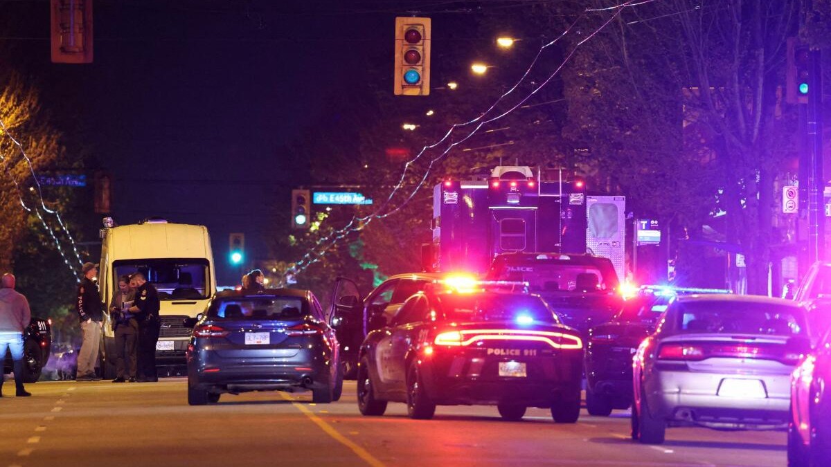 Police officers work at the scene, after a vehicle drove into a crowd at the Lapu Lapu day block party, in which police say multiple people were killed and injured, in Vancouver, Canada.