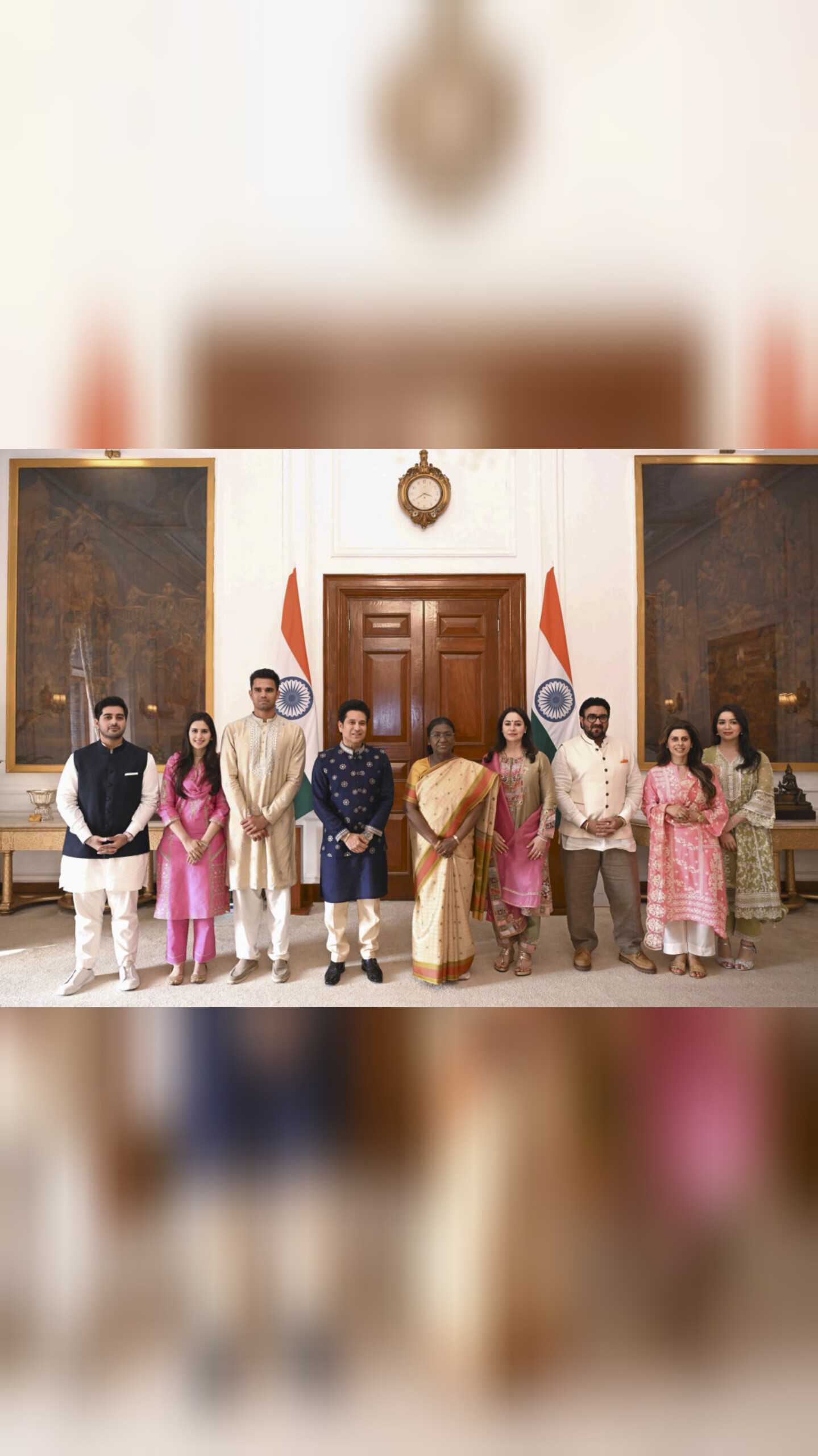 President Droupadi Murmu with former cricketer Sachin Tendulkar, his wife Anjali Tendulkar, daughter Sara Tendulkar, son Arjun Tendulkar, his would-be wife Saaniya Chandhok and others during a meeting, at the Rashtrapati Bhavan, in New Delhi. President Murmu was invited to Arjun and Saaniya's wedding.