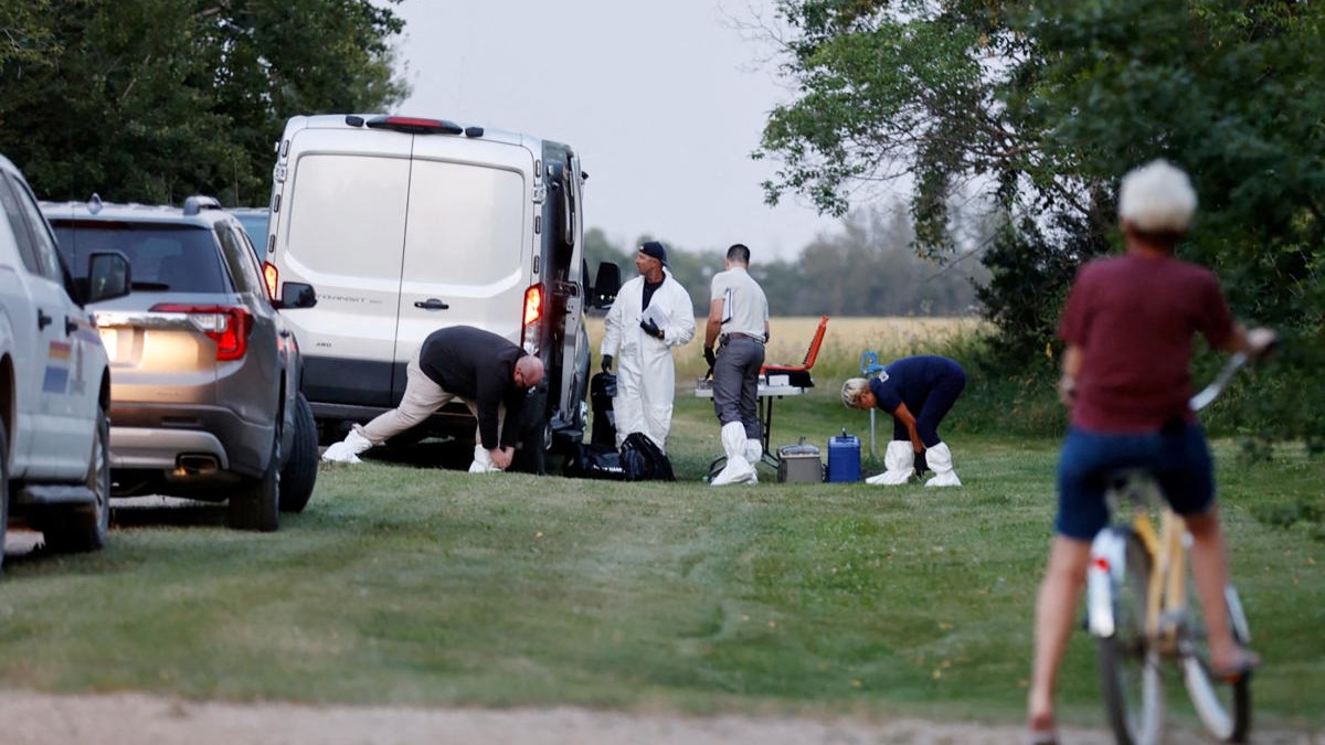 A police forensics team investigates a crime scene after multiple people were killed and injured in a stabbing spree in Weldon, Saskatchewan, Canada.