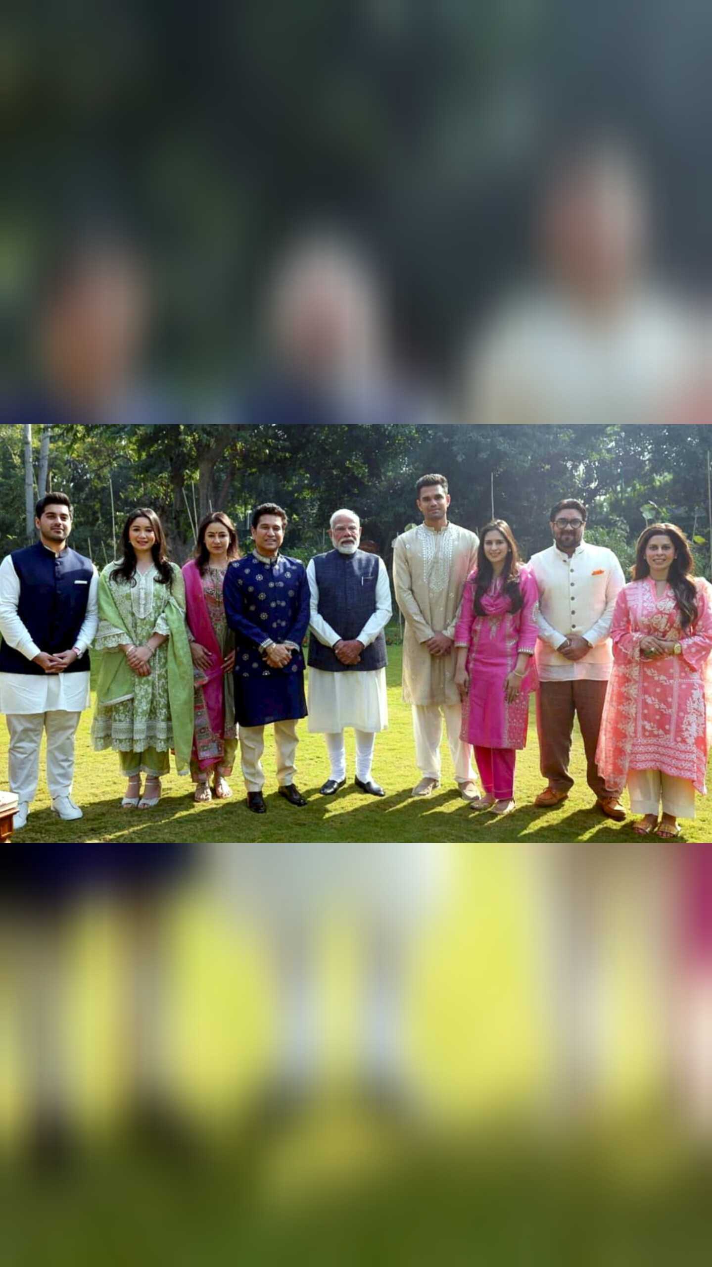 Prime Minister Narendra Modi with former cricketer Sachin Tendulkar, his wife Anjali Tendulkar, daughter Sara Tendulkar, son Arjun Tendulkar and his would-be wife Saaniya Chandhok and others during a meeting, in New Delhi. PM Modi was invited to Arjun and Saaniya's wedding.