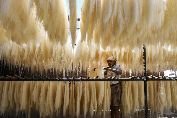 A worker prepares vermicelli at a factory during the holy month of the 'Ramadan' festival, in Prayagraj, Uttar Pradesh.