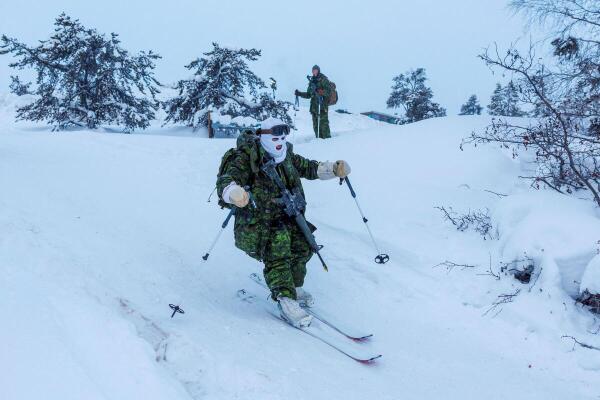 A member of 41 Canadian Brigade Group, as part of Task Force Grizzly, patrols on skis as Canadian Armed Forces deploy to "Operation Nanook-Nunalivut," a yearly series of drills designed to highlight the military’s ability to defend the Canadian Arctic, in Yellowknife, Northwest Territories, Canada.