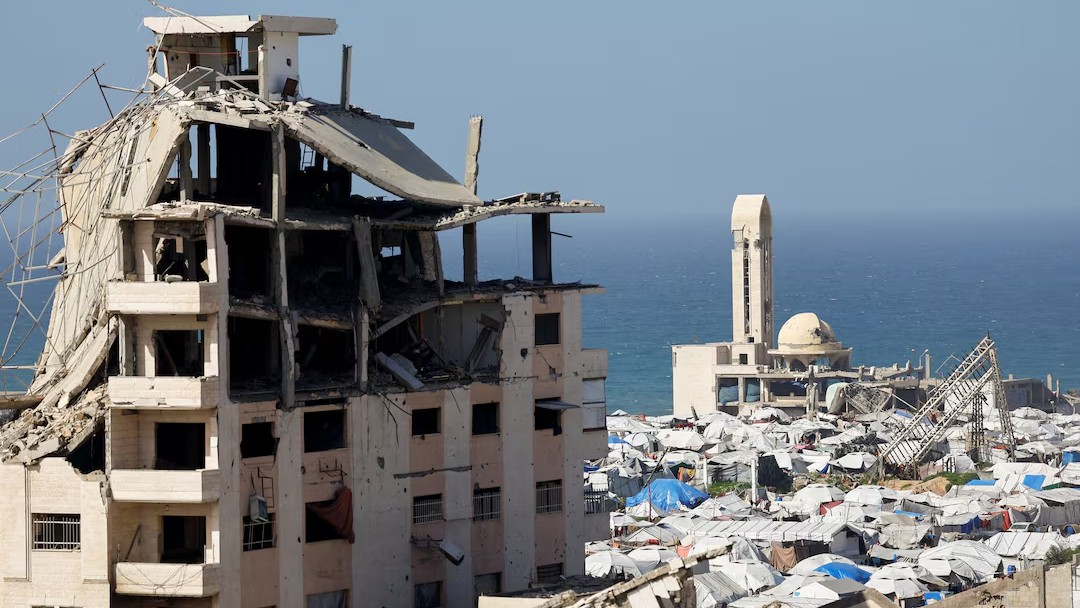 A destroyed mosque surrounded by tents for displaced Palestinians.