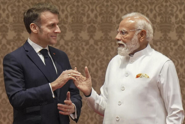 Prime Minister Narendra Modi with French President Emmanuel Macron during a joint press meet, in Mumbai.