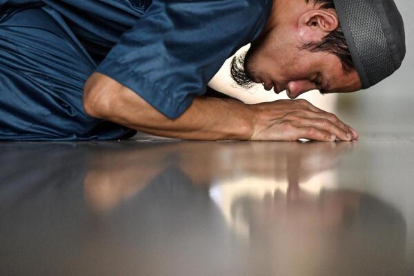 A man prays at the Golden Mosque on the first day of the holy fasting month of Ramadan in Manila, Philippines.