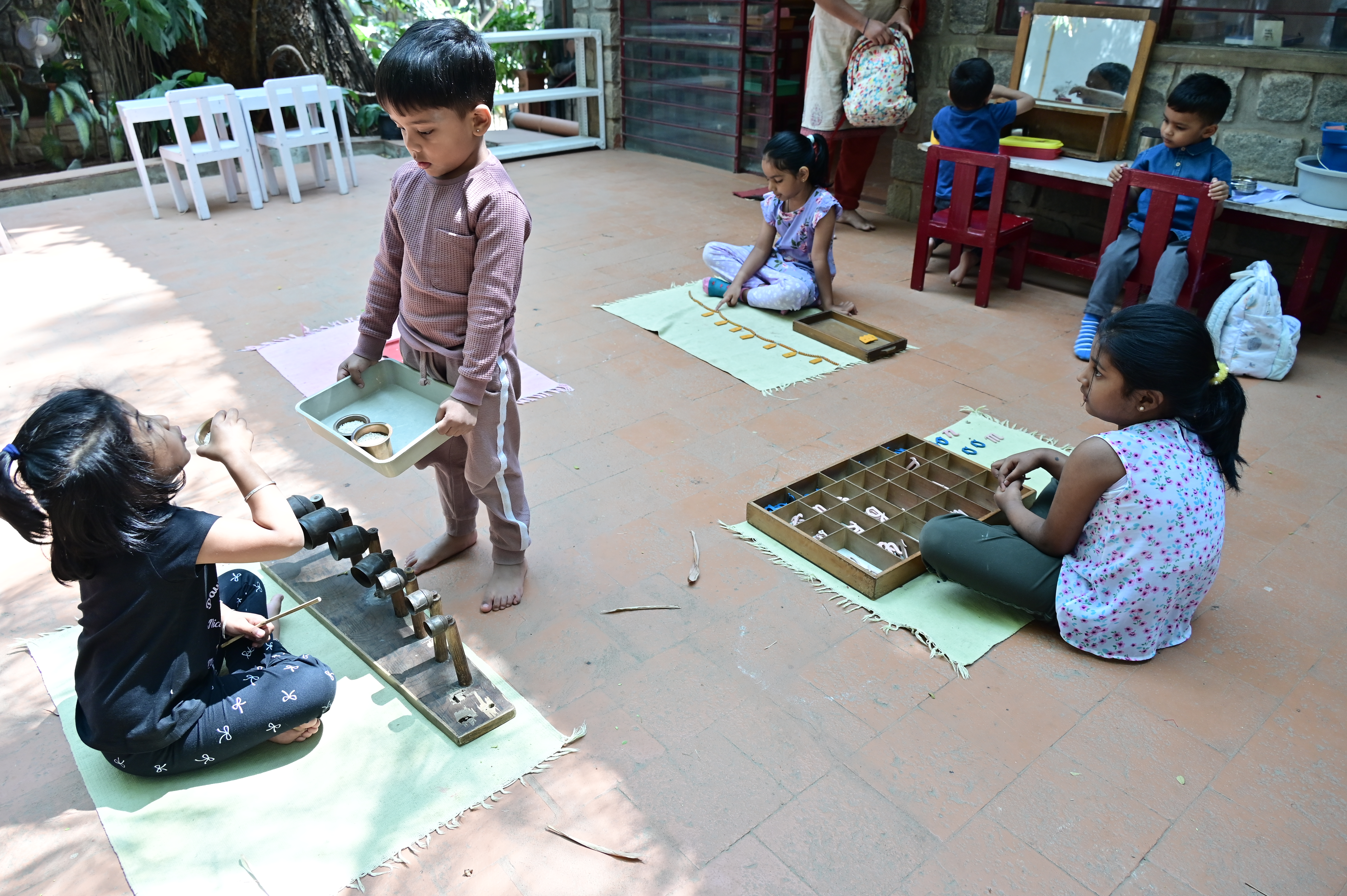 Children at Akshara Montessori House of Children learn language, maths and motor skills through activities. 