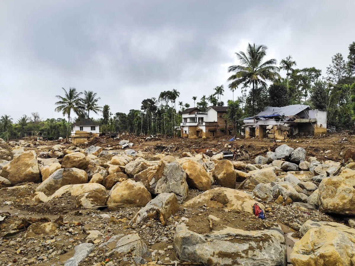 Damaged houses and the terrain in the Chooralmala village a month after the Wayanad.