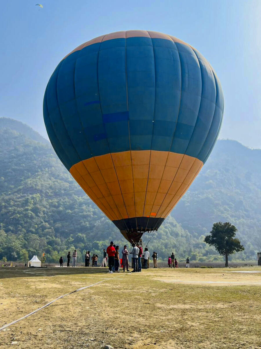 People take a hot air balloon ride during the three day Nayar Valley Adventure Festival 2026, in Pauri Garhwal, Uttarakhand