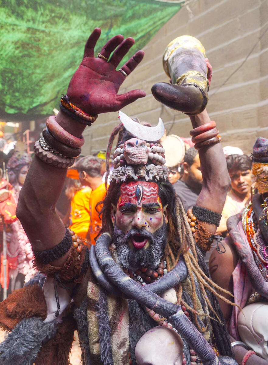 People take part in 'Holi' celebration at Manikarnika Ghat, in Varanasi, Uttar Pradesh