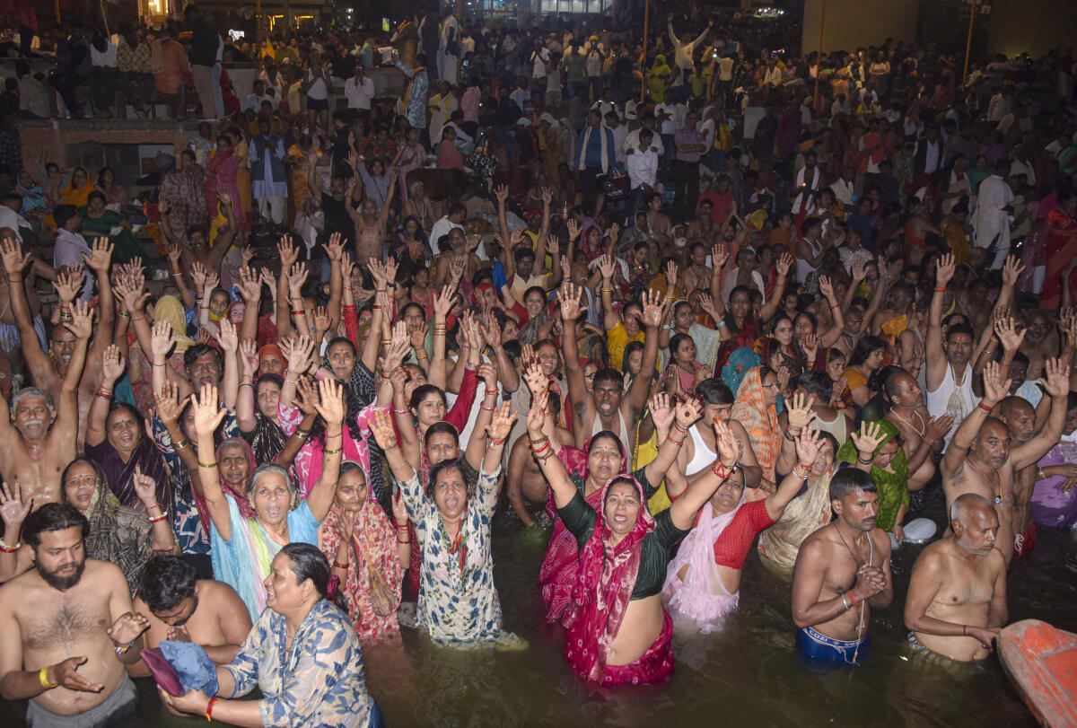 People perform rituals on the banks of Ganga river during the lunar eclipse, in Varanasi. PTI