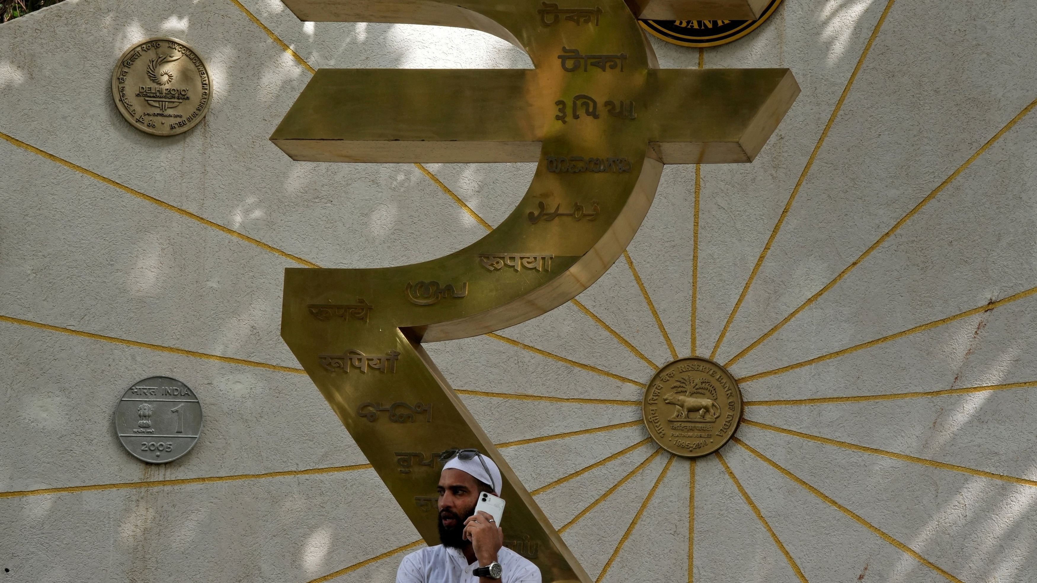 Rupee ends 6 paise lower at 91.70 against USD in range-bound trade amid West Asia crisis