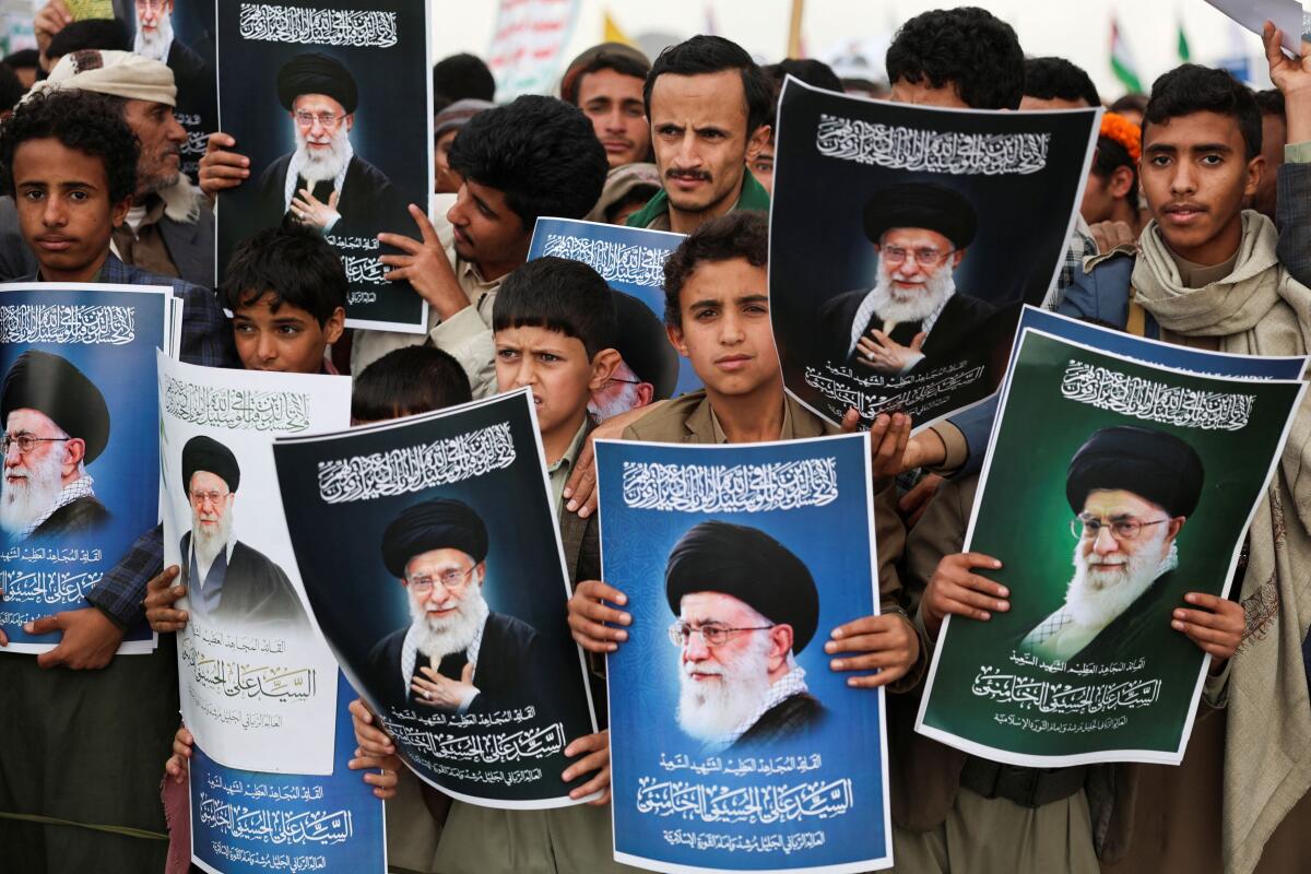 Protesters hold posters featuring pictures of late Iran's Supreme Leader Ayatollah Ali Khamenei during a demonstration by Houthi supporters in solidarity with Iran and Lebanon, amid the U.S.-Israeli conflict with Iran, in Sanaa, Yemen. Reuters