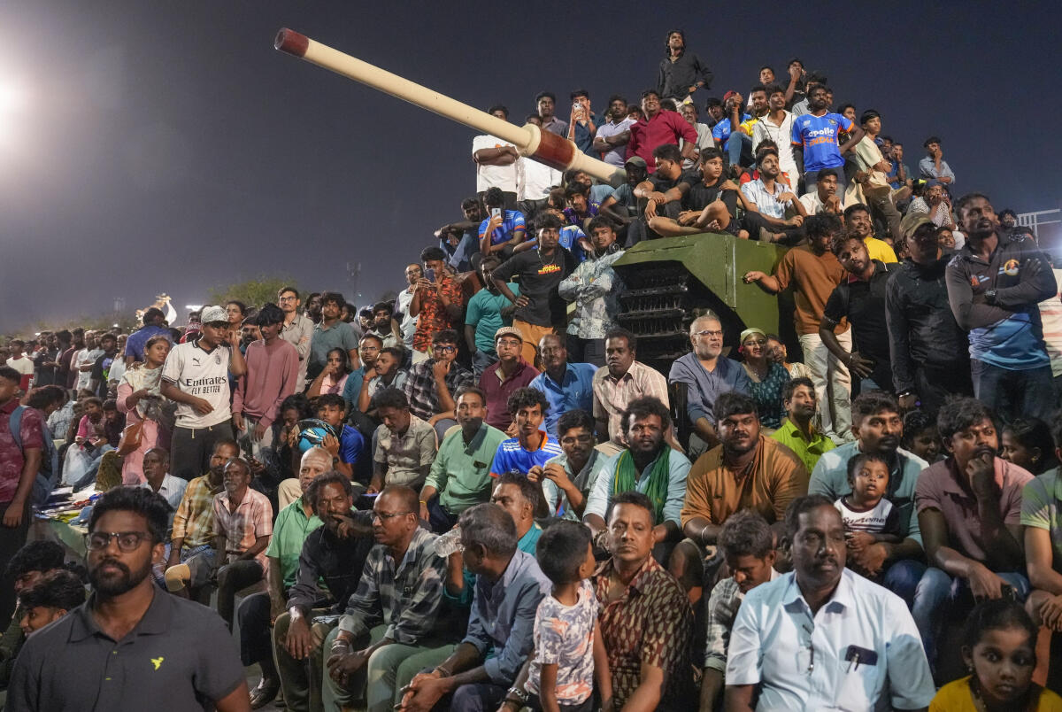 Fans gather to watch the ICC Men's T20 World Cup 2026 final cricket match between India and New Zealand, at Marina Beach in Chennai.
