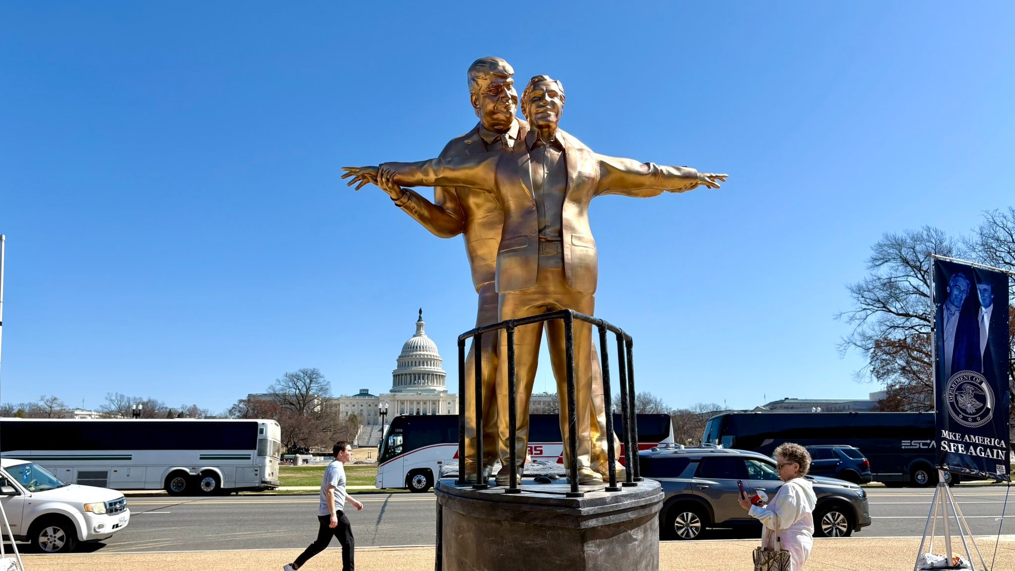 'King Of The World': Gold-painted Trump & Epstein statue comes up in Washington
