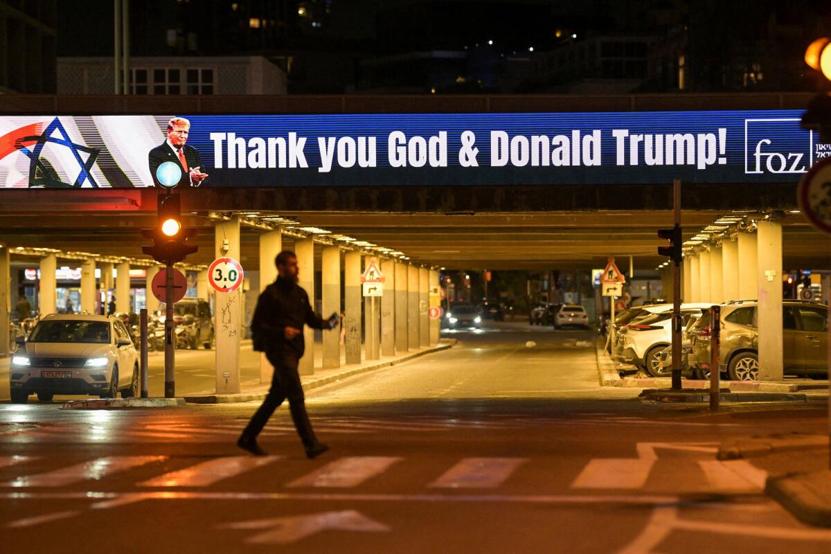 A screen displays a message in support of U.S. President Donald Trump amid the US-Israeli conflict with Iran, in Tel Aviv.