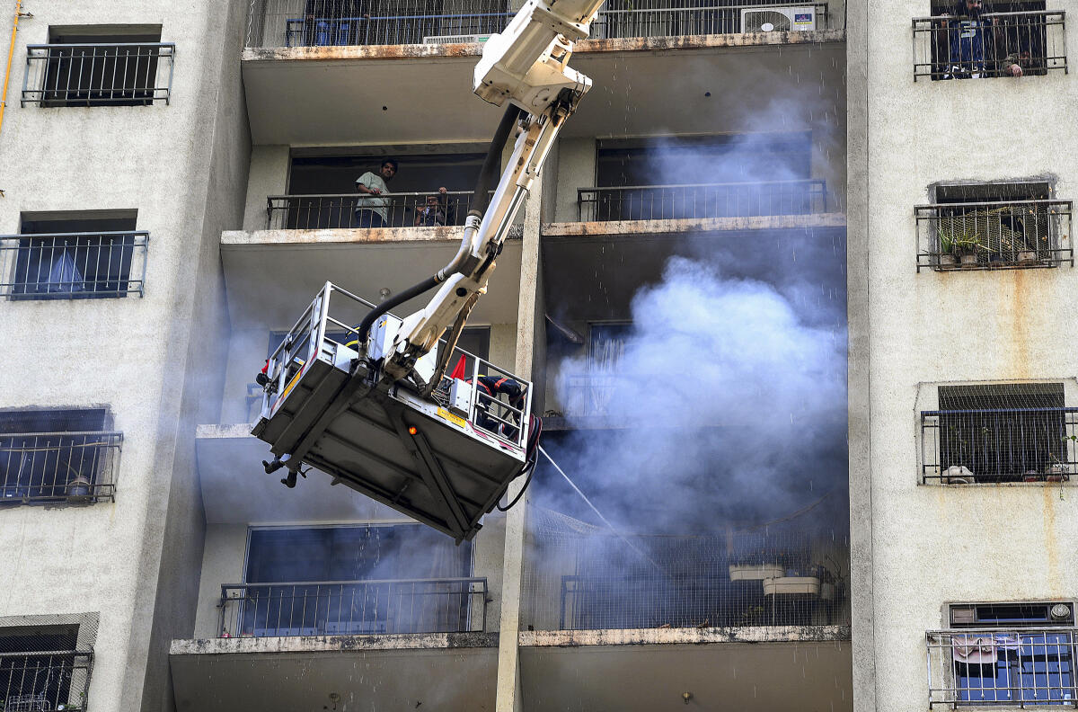 Firefighters douse blaze at Malad high‑rise in Mumbai.