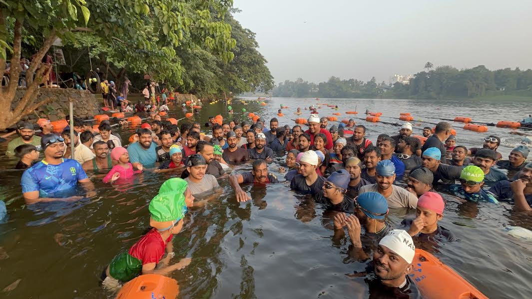 Lead Saji Valasseril teaches swimming in the Periya river in Aluva, Kerala.