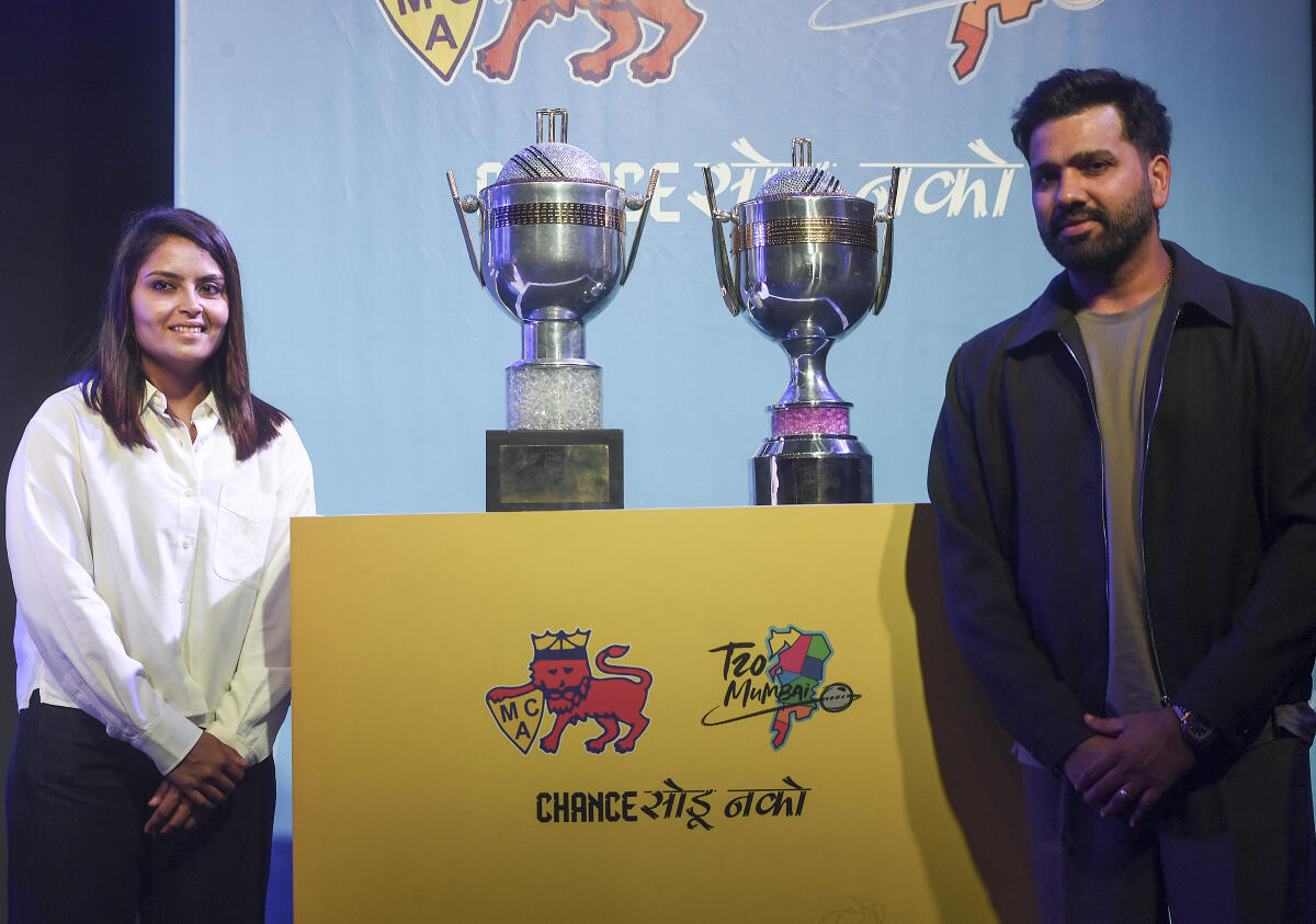 Cricketers Rohit Sharma, right, and Sayali Satghare during the launch event of T20 Mumbai League Season 4, in Mumbai, Saturday, March 14, 2026.