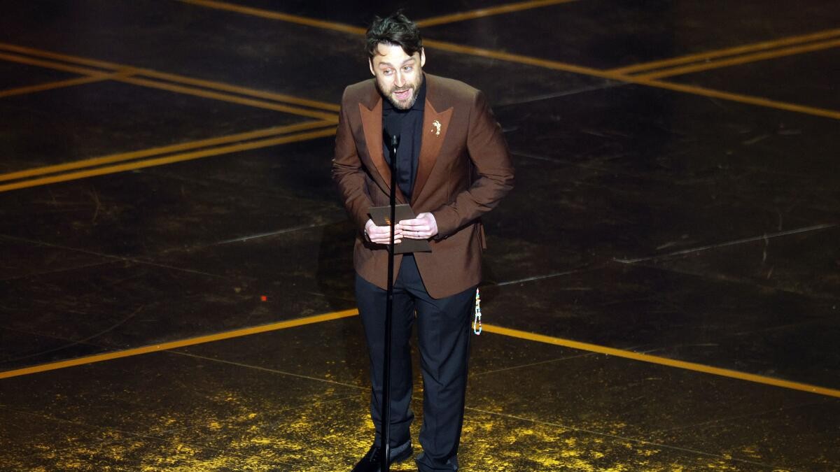 Kieran Culkin accepts the award for Sean Penn who won the Oscar for Best Supporting Actor for One Battle after Another.