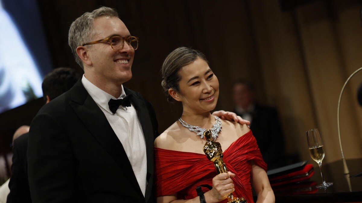 Maggie Kang poses with the Oscar for Best Animated Feature Film for KPop Demon Hunters.