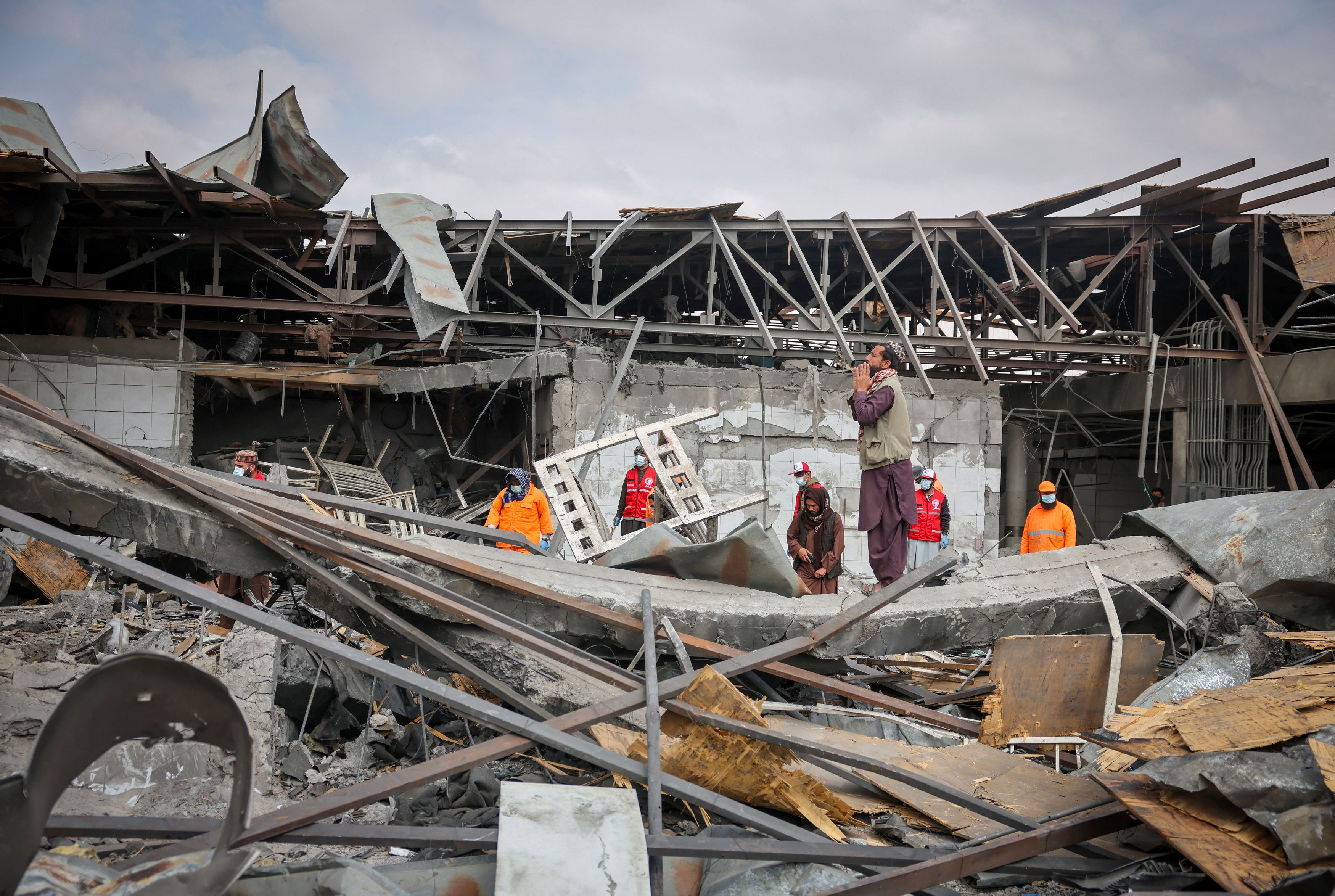 A man stands on the debris at the site of a drug rehabilitation hospital destroyed in what the Taliban said was a Pakistani air strike in Kabul, Afghanistan, March 17, 2026.