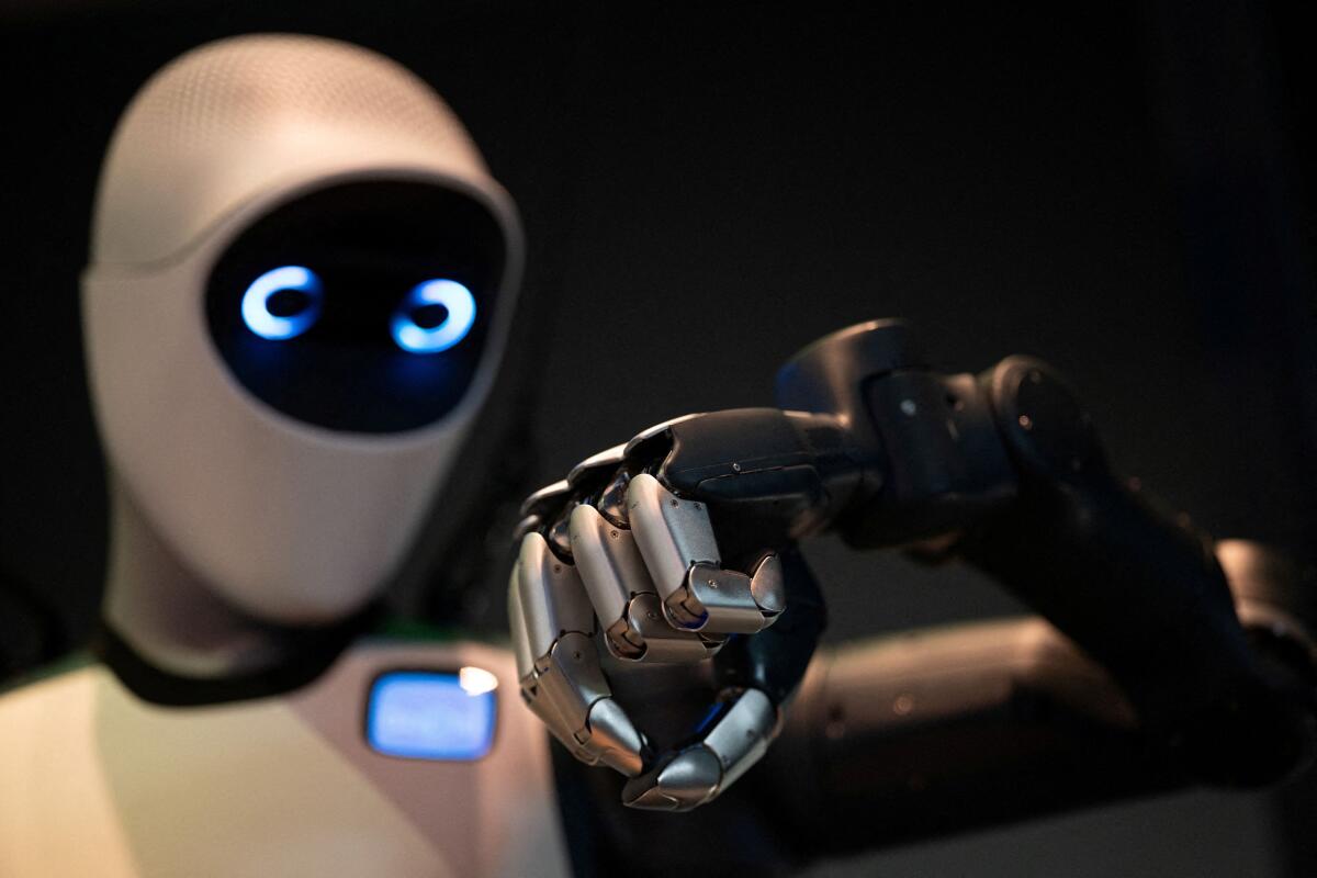 A robot demonstrates a task at the NVIDIA booth during the NVIDIA GTC global AI conference in San Jose, California, U.S., March 17, 2026. 