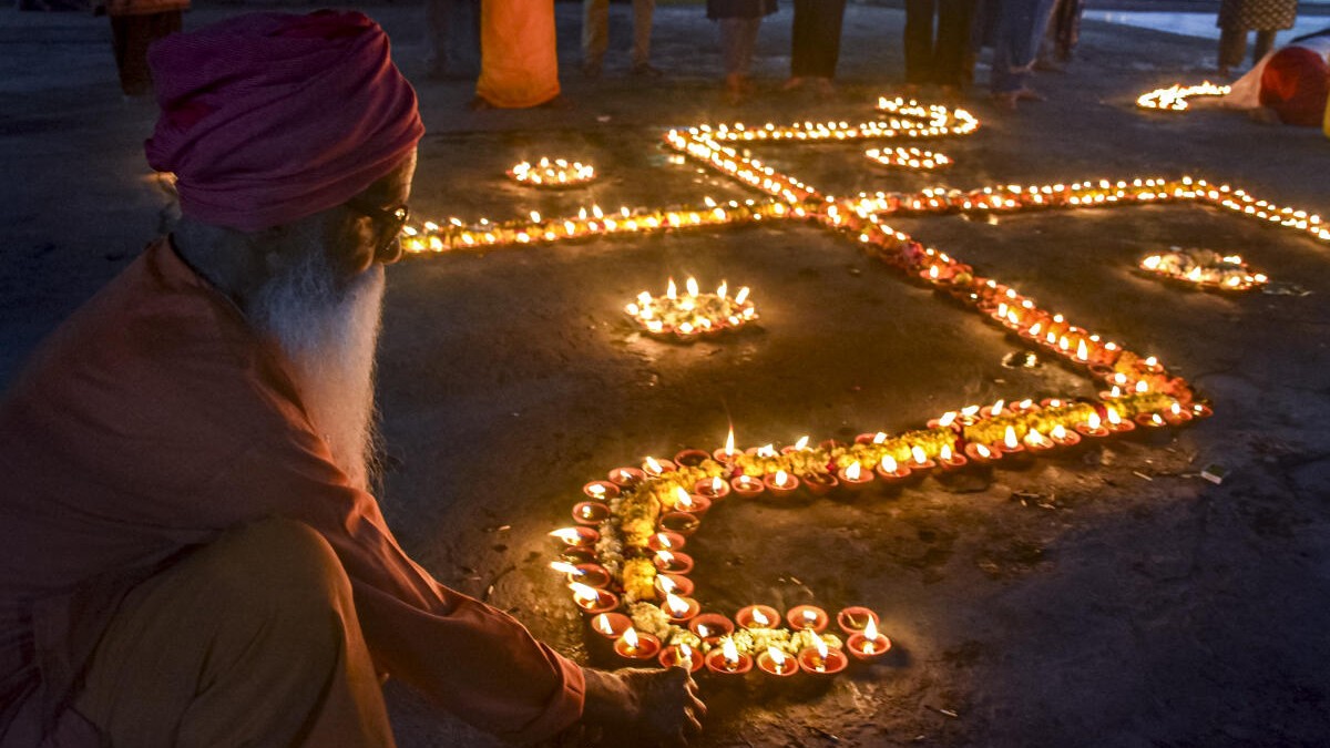 People light earthen lamps on the eve of Chaitra Navratri at a temple, in Moradabad, Wednesday, March 18, 2026.