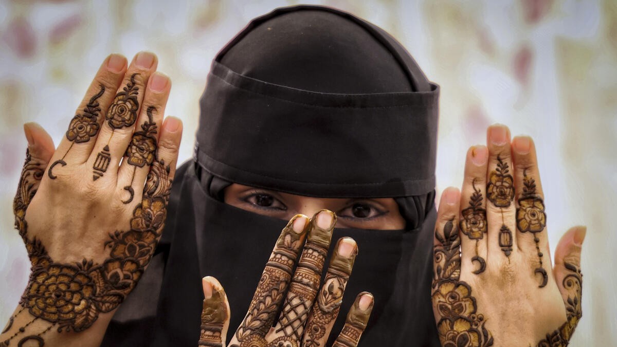 Women display intricate mehendi designs ahead of Eid al-Fitr during Ramzan, in Bengaluru.