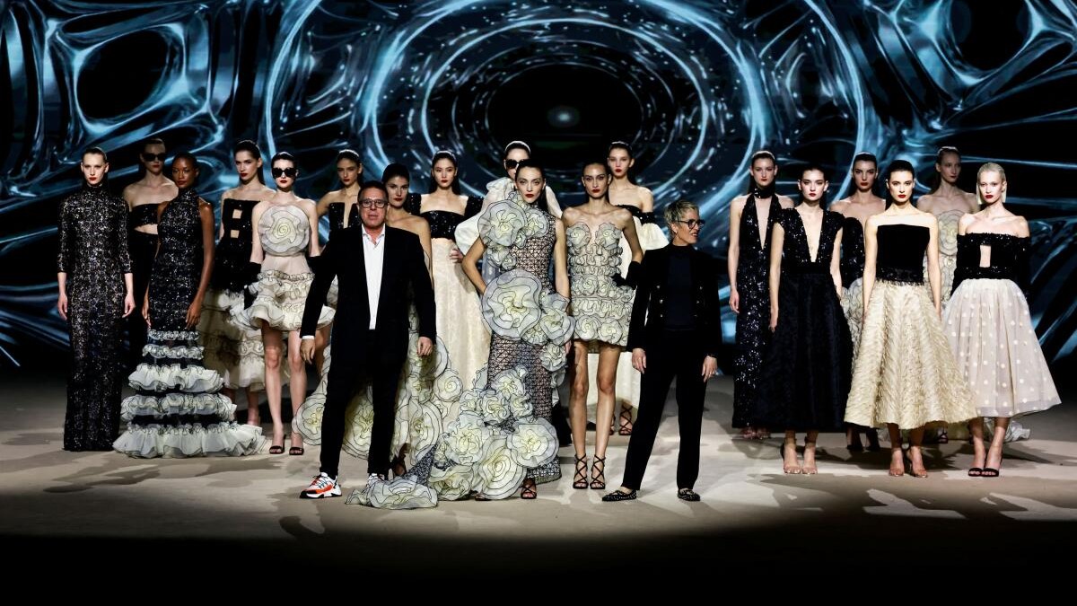 Designer Hannibal Laguna appears with his sister Isabel Angulo at the end of their 2026 show during the Mercedes-Benz Fashion Week in Madrid, Spain, March 20, 2026.