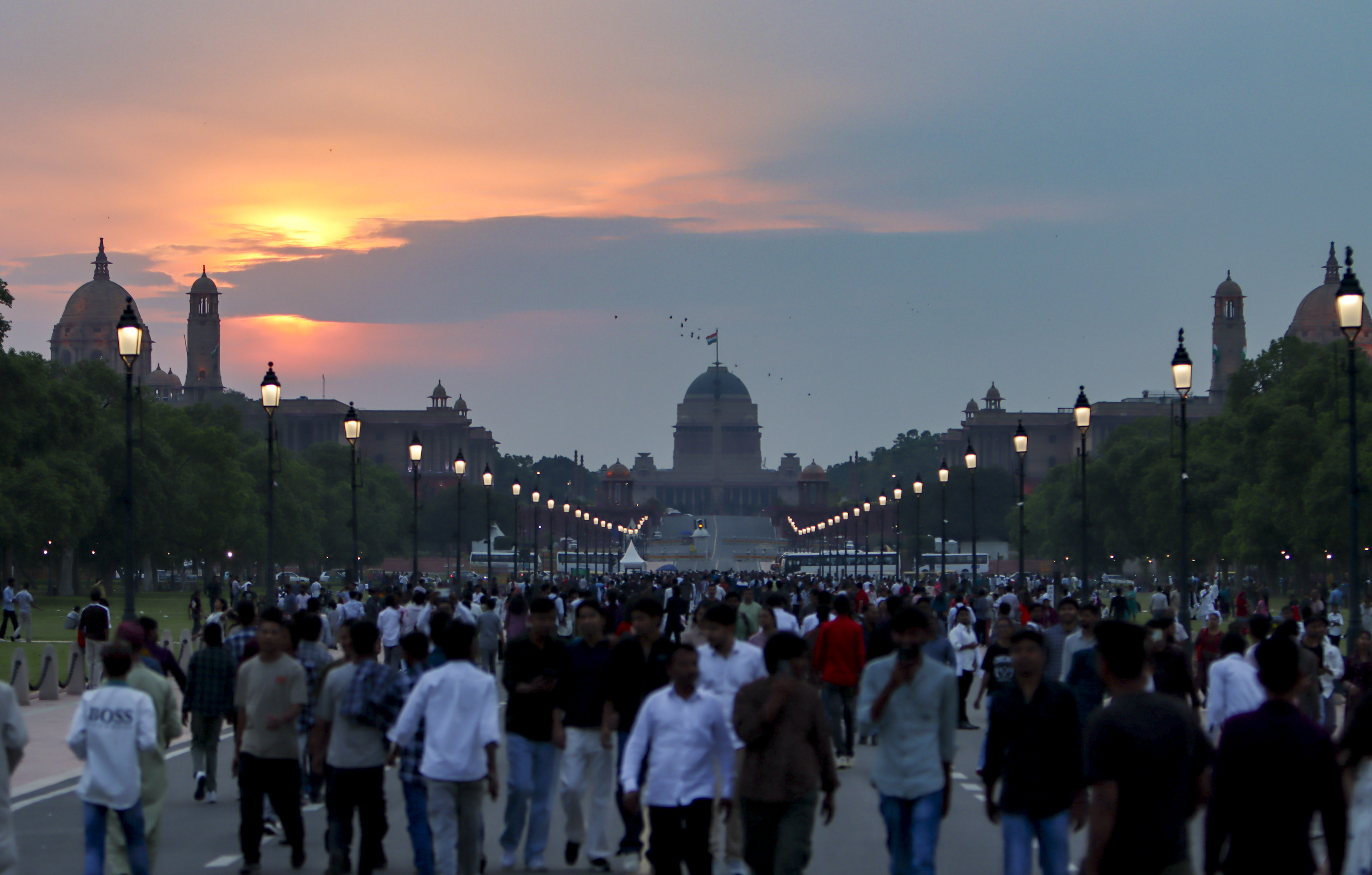 People gather during sunset on the ‘Eid al-Fitr’ festival, in New Delhi.