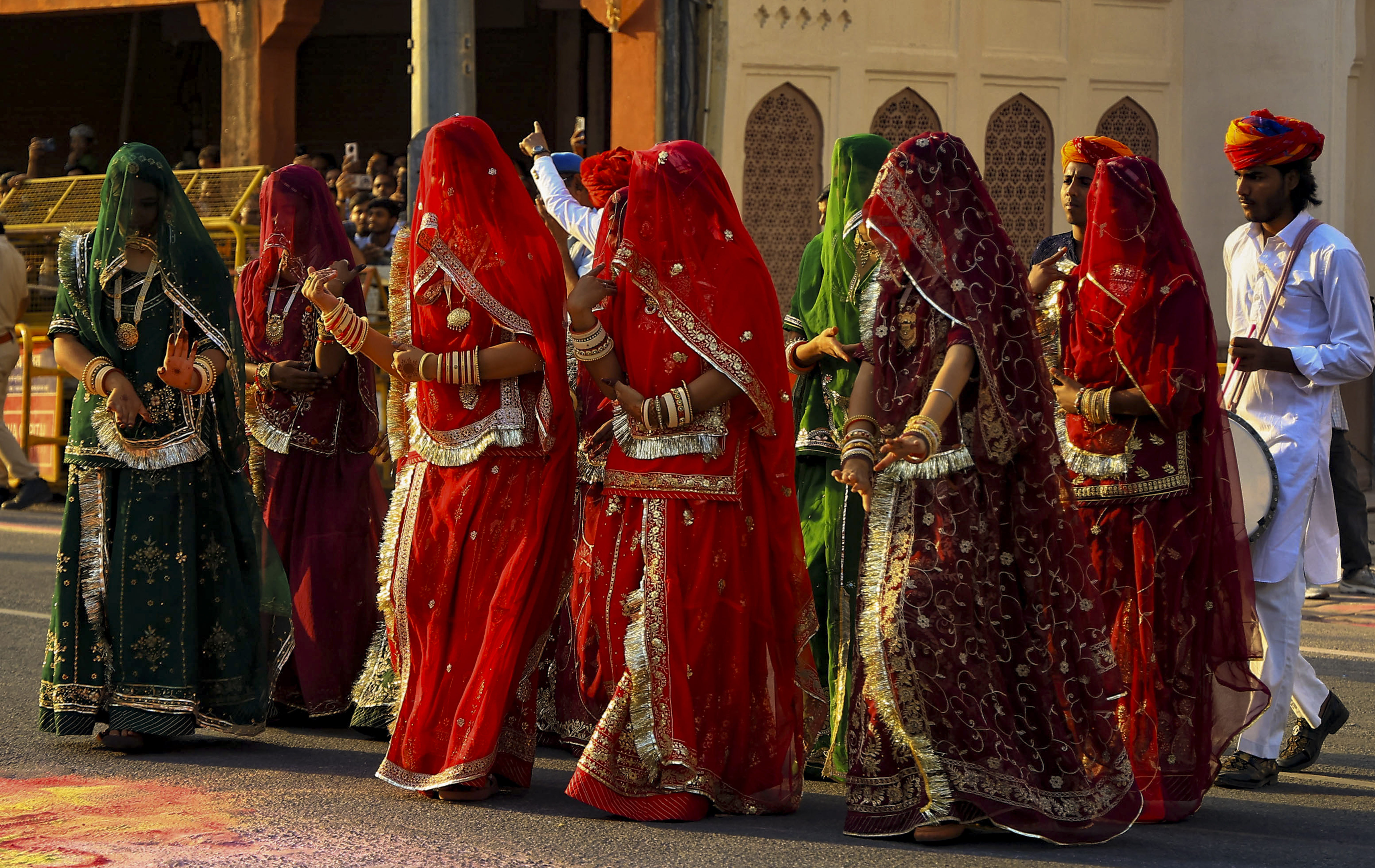 Women dressed in traditional Rajasthani attire during the ‘Gangaur’ festival procession, at Choti Chaupar in Jaipur