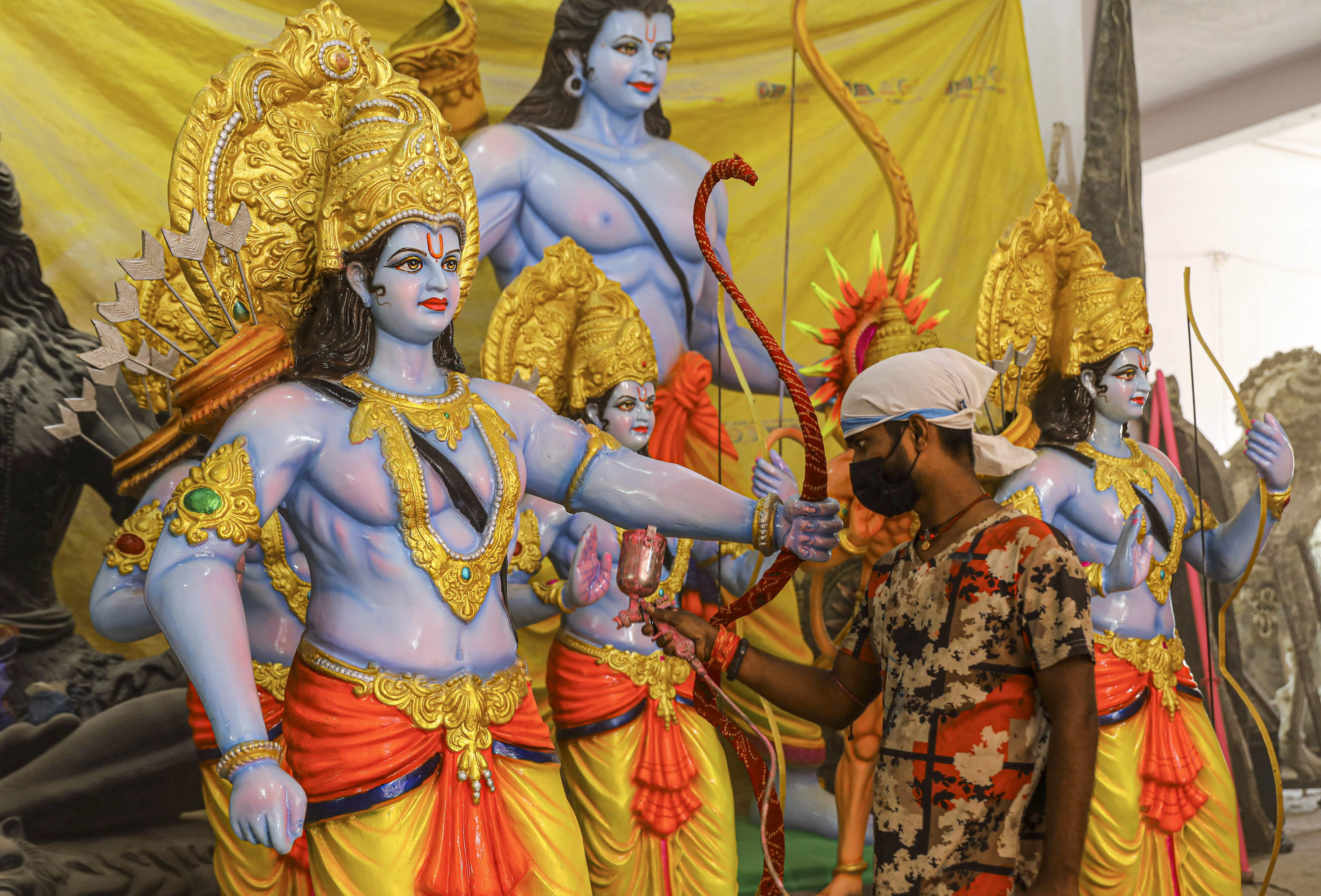 An artist gives final touches to a statue of Lord Ram ahead of Ram Navami festival, in Hyderabad,