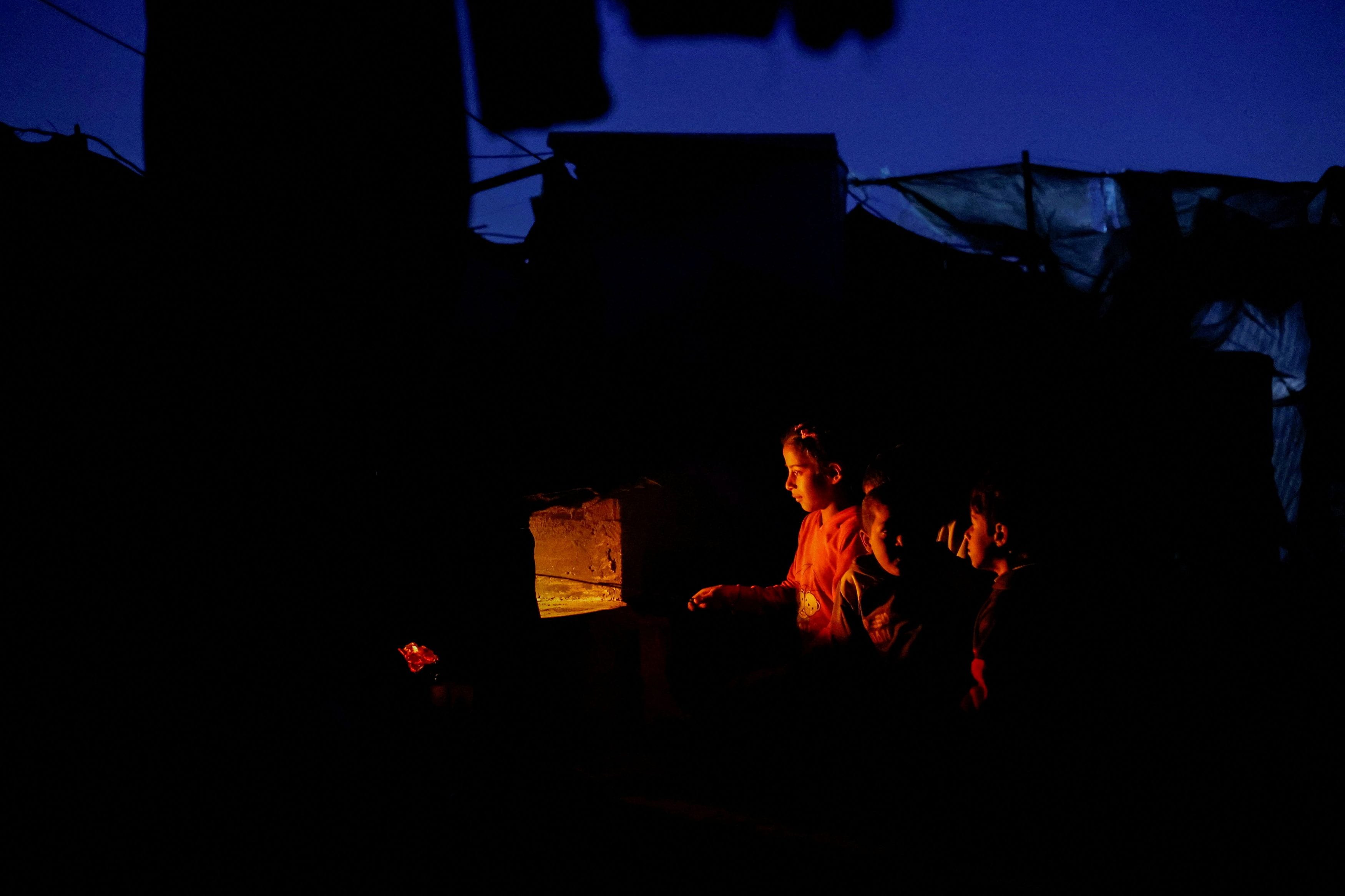 Palestinians displaced during the two-year Israeli offensive take shelter, in Zawayda in the central Gaza Strip