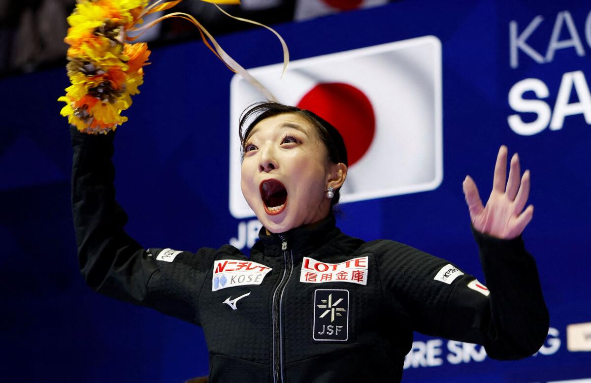 Japan's Kaori Sakamoto celebrates after winning the Women's Free Skating at the ISU Figure Skating World Championships in Prague, Czech Republic