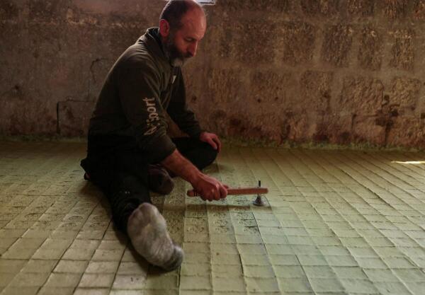 A worker makes laurel soap at a soap factory in Aleppo, Syria.