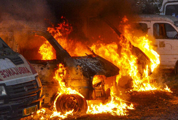 Flames and smoke billow out after parked ambulances caught fire, near Patliputra Colony, in Patna.