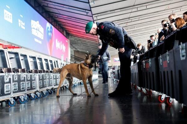 A police officer with a K9 takes part in a demonstration of security measures for the upcoming Eurovision Song Contest 2026 in Vienna, Austria.