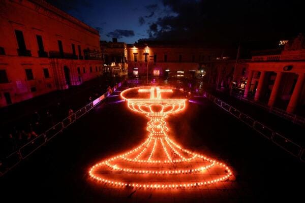 An installation in the shape of a chalice and host formed by fire bowls, designed by Maltese artist Keith Zerafa as part of the Holy Week celebrations, in Valletta, Malta.