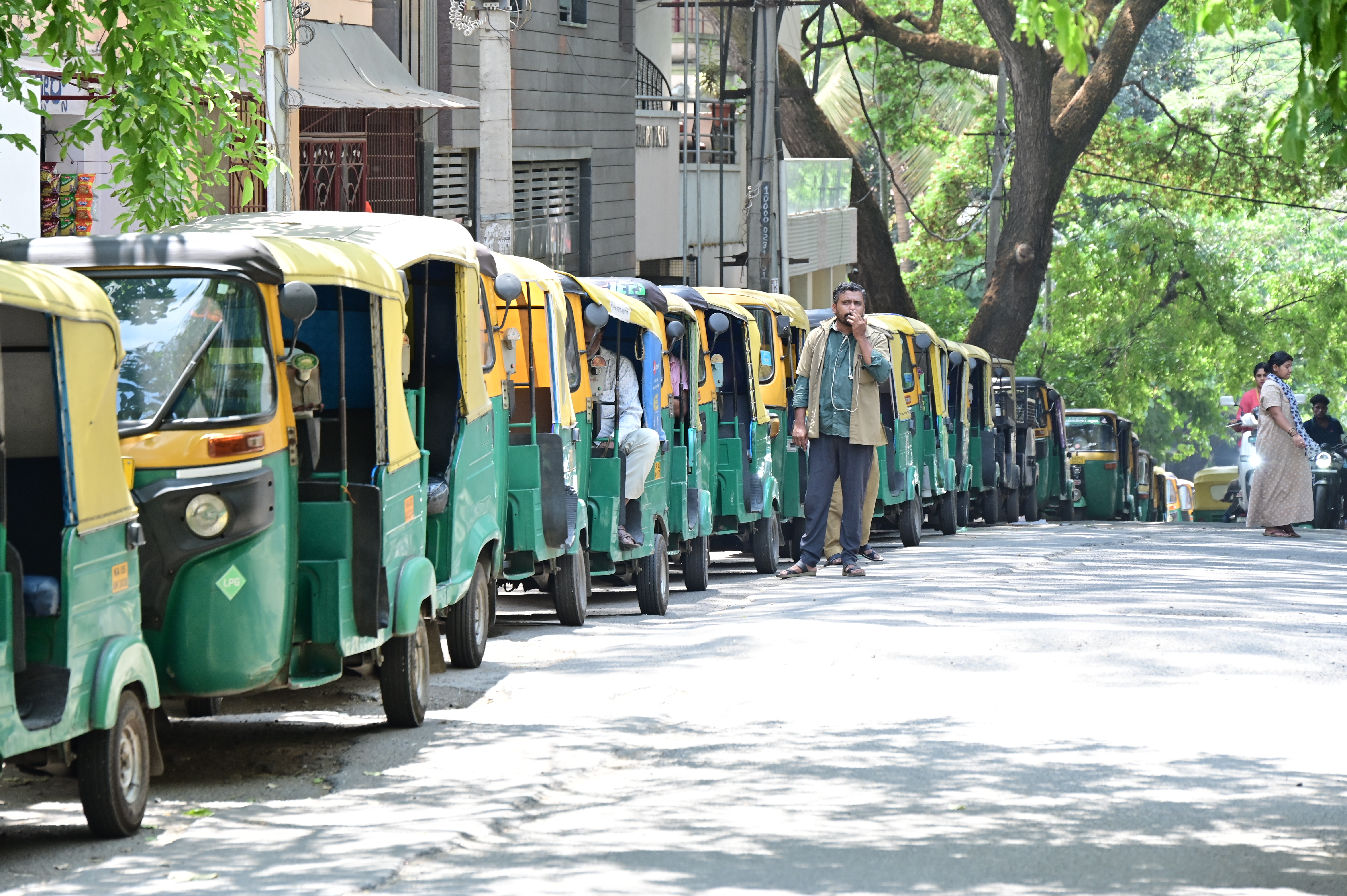Auto-rickshaws lined up near a fuel station at Girinagar in Bengaluru on Friday. DH Photo/B K Janardhan