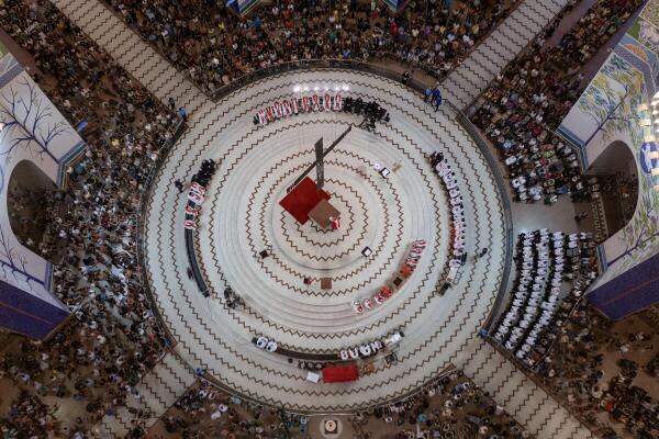Faithful attend Good Friday celebrations at the Basilica of Our Lady of Aparecida during Holy Week, in Aparecida, Brazil.